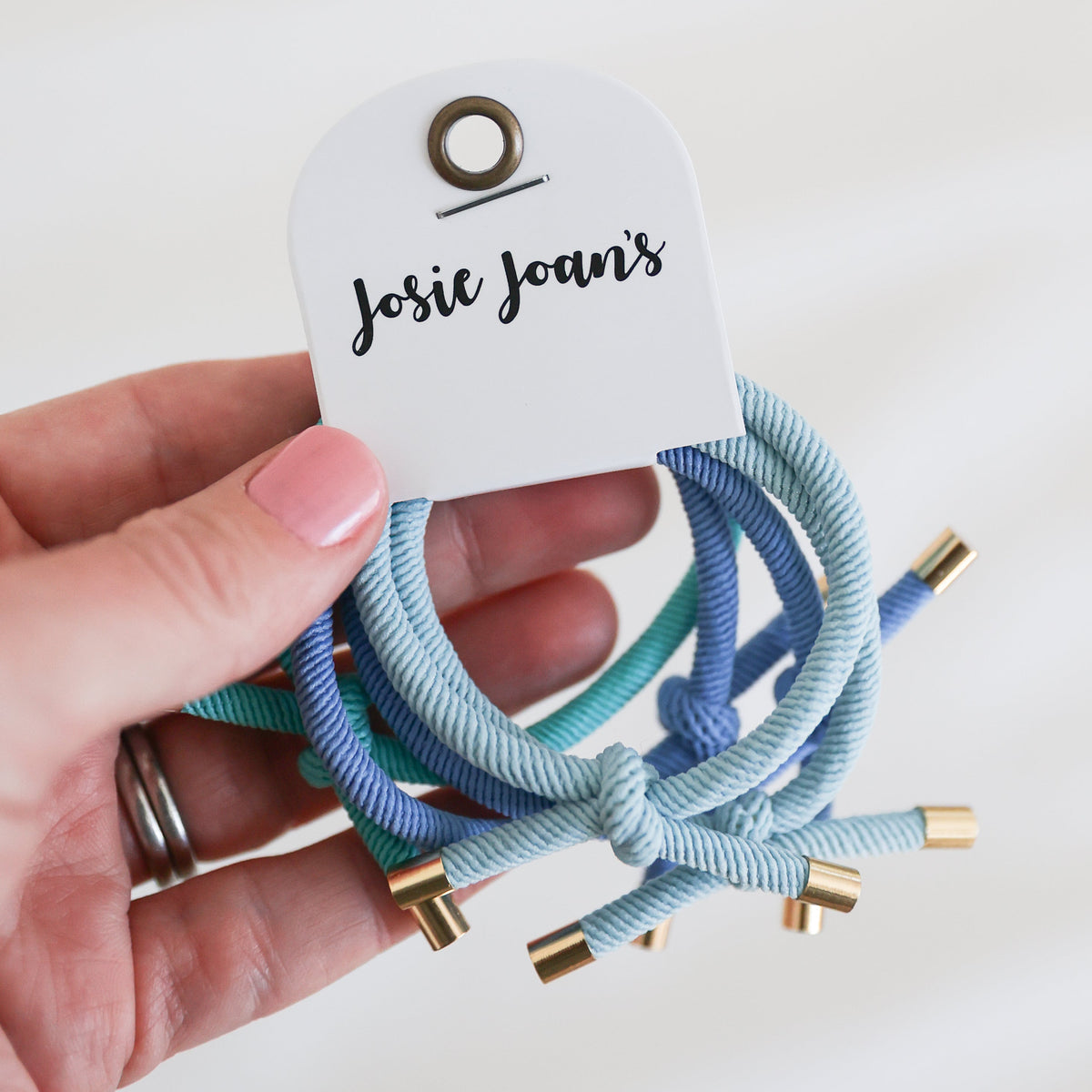 Blue hair ties with gold detail